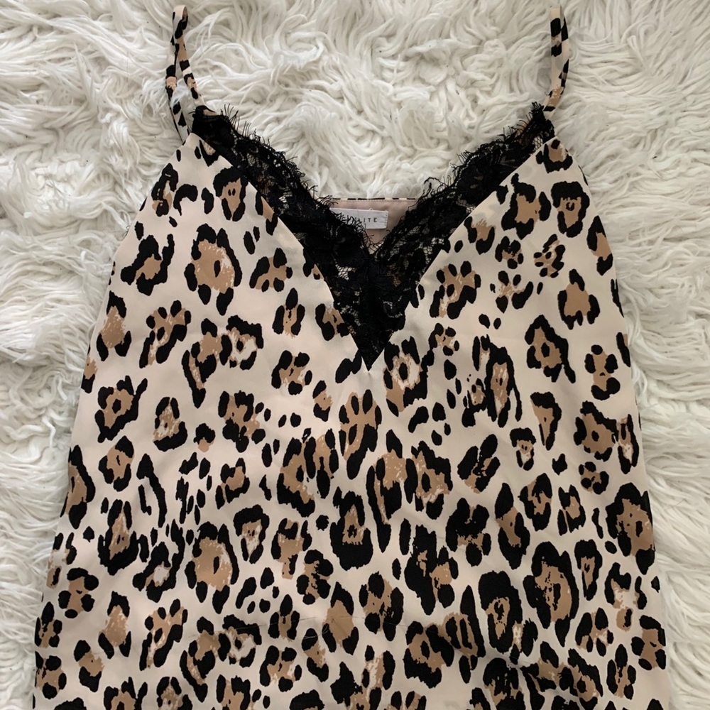Cheetah print tank top with lace trim.